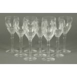 A set of nine Jasper Conran Stuart Crystal red wine glasses, each with faceted body, long stem and