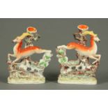 A pair of Victorian Staffordshire leaping gazelle spill holders.  Height 11 ins (see illustration).