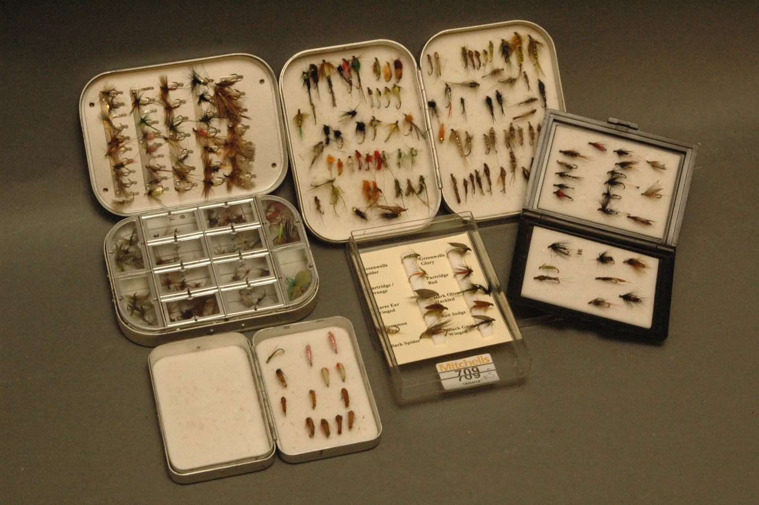 5 fly boxes containing trout flies, including Wheatley dry fly box and 2 other alloy boxes.