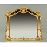 A Victorian giltwood and gesso overmantle mirror, Rococo style.  Width 121 cm, height 118 cm.