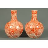 A large pair of Chinese dragon vases, orange and white, each with character mark to base.