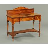 An Edwardian inlaid rosewood desk by Shoolbred, with rear upstand, tooled leather writing surface,