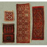 * Four small Afghan rugs, each with iron red ground.  Largest 43 cm x 129 cm.  CONDITION REPORT: The