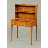 An Edwardian mahogany writing table, with shelved superstructure,