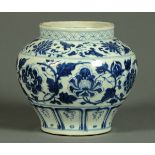 A Chinese blue and white vase, of squat baluster form, with repeating foliate decoration in blue and