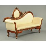 A wooden framed settee,