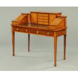 An Edwardian inlaid rosewood and mahogany Carlton House style desk, with series of drawers,