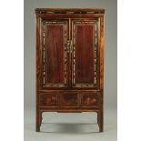 A Chinese lacquered wardrobe,