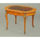 A Victorian walnut marquetry oval writing or centre table,