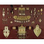 * A collection of Turkoman silver, white metal, gilt and carnelian set jewellery, 19th/20th century,