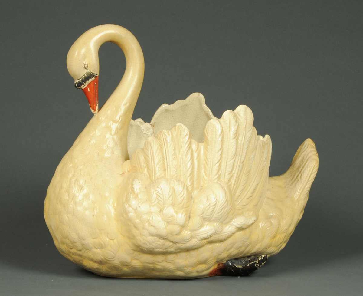 * A large pottery centre piece, modelled as a mute swan.  Height 41 cm.