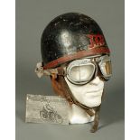 A vintage motor cycle helmet, Jap, formerly the property of Versey Graham, and a pair of goggles.