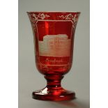 * A 19th century Bohemian glass goblet, etched with buildings.  Height 13 cm.