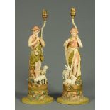 A pair of Continental porcelain table lamps, in the Royal Dux style,