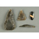 * A flint arrowhead, spearhead and two small worked pieces of flint.  Longest 6 cm. CONDITION