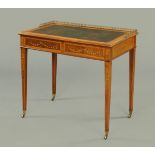 An Edwardian mahogany and satinwood banded desk, with brass gallery,