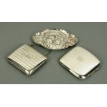 A silver cigarette case, Birmingham 1912, a silver pin tray stamped with cherubs heads, London 1898,