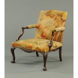 A 19th century mahogany Gainsborough type chair, with gros point upholstery depicting a hoho bird in