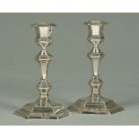 A pair of Queen Anne style silver baluster candlesticks, with detachable sconces, knopped stems