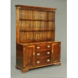 A 19th century oak dresser, with matched Delft rack,