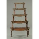 An Anglo-Indian rosewood whatnot stand, five tier graduated.  Maximum width 90 cm.