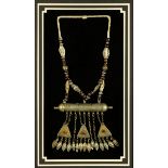 * A Turkoman necklace, black and white beads.