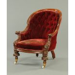 A Victorian mahogany gentleman's armchair, with exposed moulded and scrolling showframe,