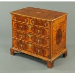 A William & Mary oyster veneered chest of drawers, two short and three long graduated drawers with