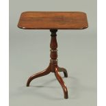 A Victorian mahogany rectangular topped tripod table, with snap action,