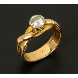 An 18 ct gold solitaire diamond ring, in twist setting, size K (see illustration).