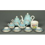 A collection of Russian ceramics, comprising teapot, lidded sucrier, four cups and four saucers,