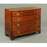 A George III mahogany bowfronted chest of drawers,