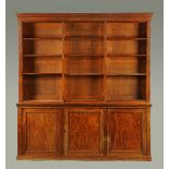 A Victorian mahogany open bookcase and cupboard,