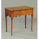 A George III oak lowboy, with moulded edge, single frieze drawer,