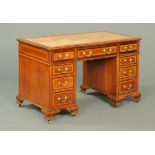 An Edwardian inlaid mahogany kneehole desk, bearing label "Thomas Dowdall, Cabinetmaker,