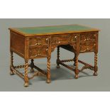 An oak kneehole desk, 1930s, green gilt tooled leather writing surface,