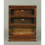 * An oak Globe Wernicke three section bookcase, the lower tier with integral plinth.  Width 37 cm.