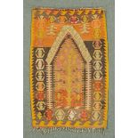 * A small Kelim prayer mat, orange, brown and beige,with one fringed end.  74 cm x 119 cm.