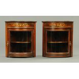 A pair of Edwardian inlaid rosewood bowfronted hanging corner cabinets.  Width 50 cm.