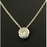 An 18 ct white gold pendant, on white gold chain, rubover set with a single diamond weighing .