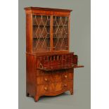 A George III mahogany secretaire bookcase, the top half with moulded dentil cornice above a pair