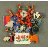 * A collection of felt items, including a yurt, floral sprays, single flowers, poppy panel,