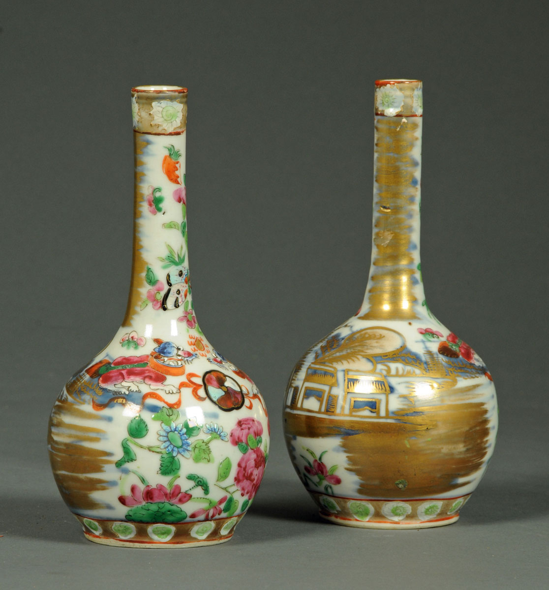 A pair of 19th century Cantonese club shaped vases, decorated with dogs, butterflies and foliage.