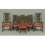 A set of two carver arm and six single late 19th century oak dining chairs, each with carved top