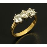 An 18 ct yellow gold three stone diamond ring, set with diamonds weighing 1.