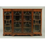 An Edwardian mahogany breakfront low bookcase,