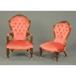 A pair of Victorian walnut ladies and gentlemens chairs,