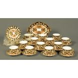 A Royal Crown Derby Imari patterned tea service, twelve cups, twelve saucers, eleven side plates and