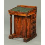 A Regency rosewood Davenport, with slope front, four actual and four dummy drawers,