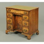 A George III style mahogany kneehole desk,